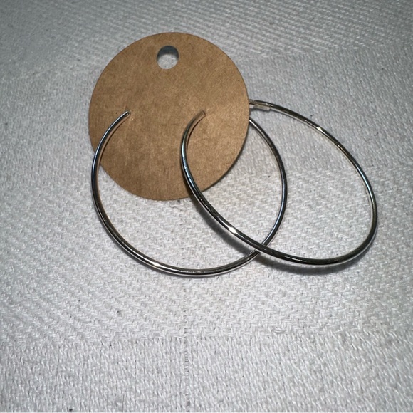 Silver toned medium hoop bangle earrings - Picture 2 of 4